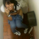 An Asian-American girl is video-recorded by her friends as she finishes shitting while talking on her cell phone in a public restroom.